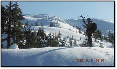 Boyd Porter tracking a bear in a winter den