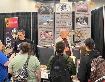 Travis Booms and Ron Clarke with his Gyrfalcon at the Alaska Federation of Natives Convention in 2025