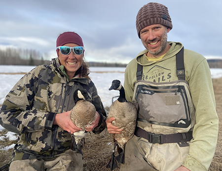 Waterfowl biologists Tasha DiMarzio and Michael Guttery holding geese See the video at the end for more on using rocket nets to capture geese